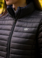 Close up of Woof Wear logo on heated quilted jacket